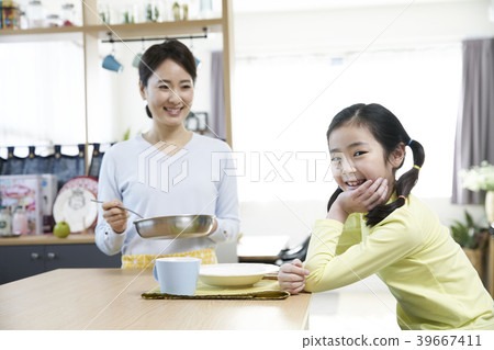 Mother and daughter in the kitchen Mother and daughter in the kitchen 39667411