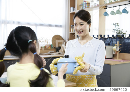 Mother and daughter in the kitchen 39667420