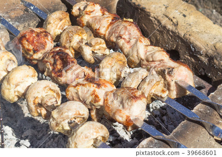 Meat dish on an open fire 39668601