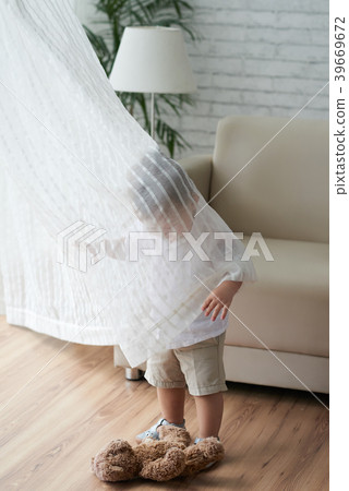 Kid in curtain 39669672