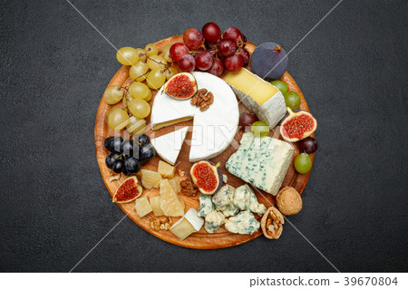 Brie cheese on a wooden Board with fresh figs and Brie cheese on a wooden Board with fresh figs and 39670804
