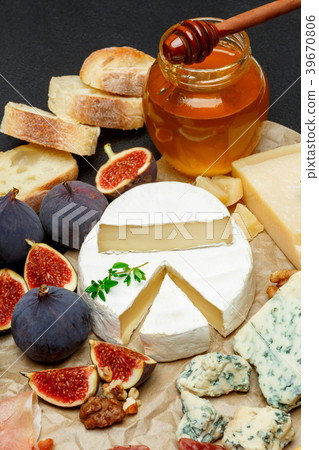 Brie cheese on a wooden Board with fresh figs and Brie cheese on a wooden Board with fresh figs and 39670806