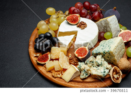 Brie cheese on a wooden Board with fresh figs and Brie cheese on a wooden Board with fresh figs and 39670811