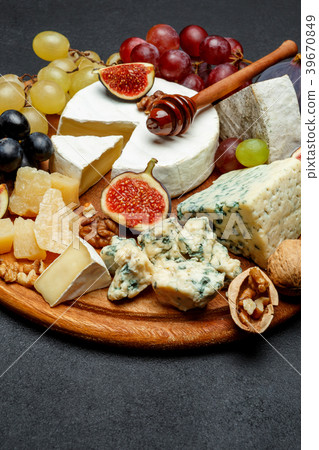 Brie cheese on a wooden Board with fresh figs and Brie cheese on a wooden Board with fresh figs and 39670849