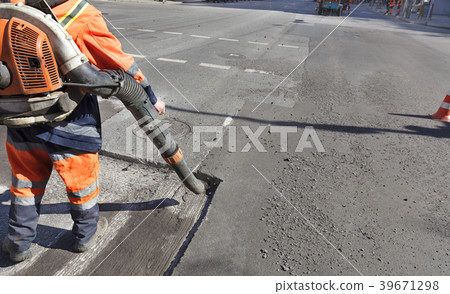 Partial repair of the asphalt road.  39671298