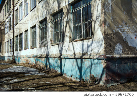 Old building in sunny weather with spring puddles  Old building in sunny weather with spring puddles  39671700