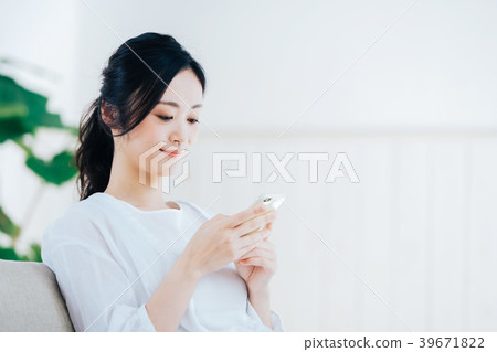 A young lady with a smartphone A young lady with a smartphone 39671822