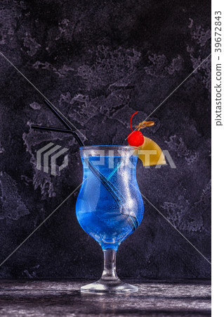 Blue Curacao cocktail decorated with fruit. 39672843
