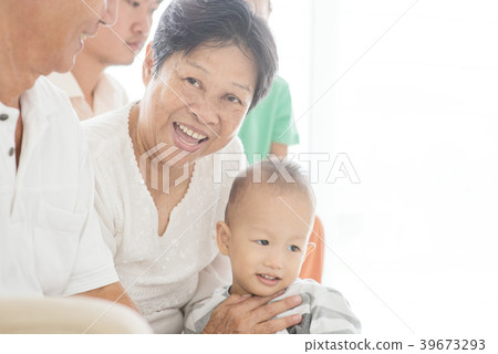 Happy family sitting at home 39673293