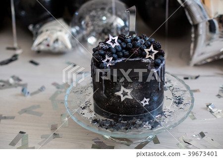 black cake with stars and berries black cake with stars and berries 39673401