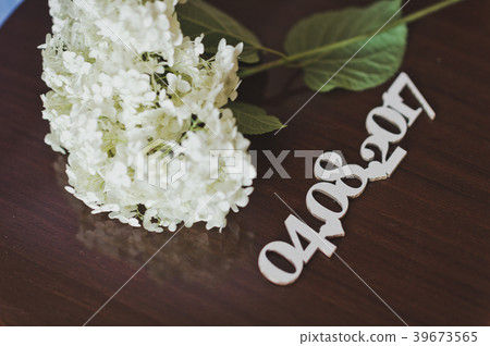 The flower on the table with the cut out date 496. 39673565