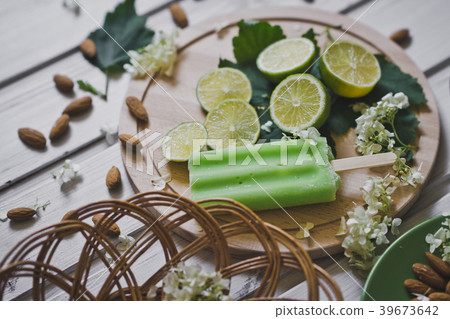 Dish with lemon and ice on a wooden table 446. 39673642