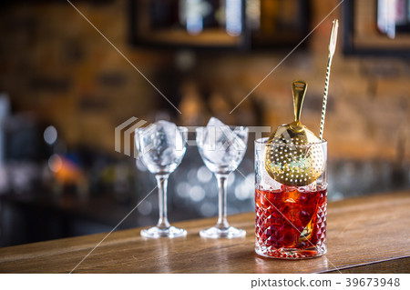Manhattan cocktail drink decorated on bar. 39673948