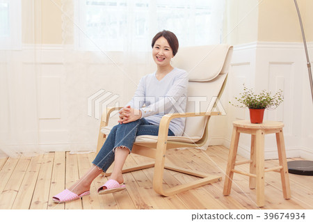A housewife sitting on a chair 39674934