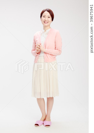 Housewife standing on white background 39675941