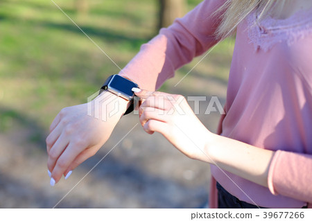Close up female hands using smart watch. 39677266