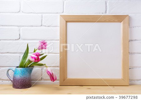 Wooden square frame mockup with pink tulip Wooden square frame mockup with pink tulip 39677298
