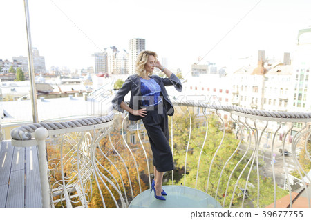 Female photo model standing on balcony with Female photo model standing on balcony with 39677755