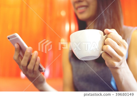 Young in an using telephone in coffee Young in an using telephone in coffee 39680149