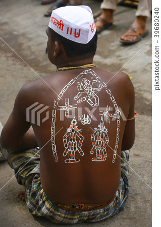 Man with painting of deities on his back Man with painting of deities on his back 39680240