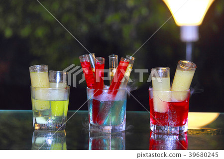 Close-Up Of drinks in test tubes and long glasses 39680245