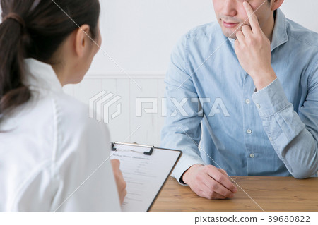 Counseling women and men in white coats Counseling women and men in white coats 39680822