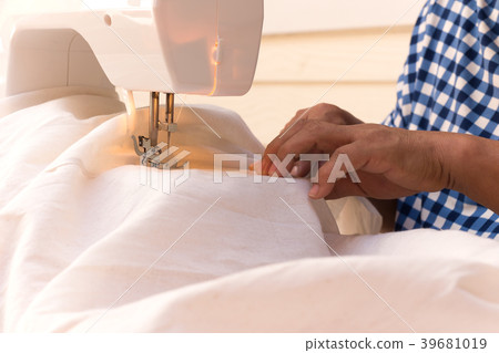 Woman's sewing linen cotton with sewing machine 39681019