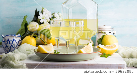 Home made limoncello in stemmed glasses 39682093