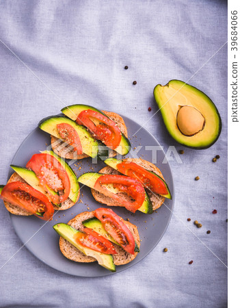 Toast with avocado and tomato slices Toast with avocado and tomato slices 39684066
