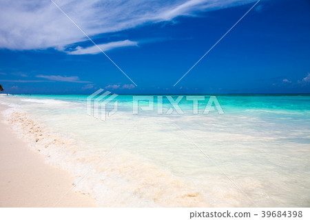 tropical beach with blue water background 39684398