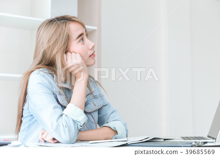 Asian young employee thinking or imagination dream 39685569