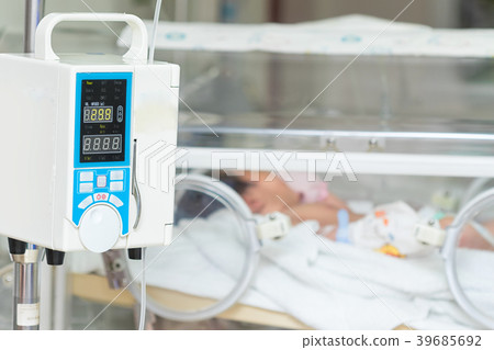 Infusion pump intravenous IV drip into baby 39685692