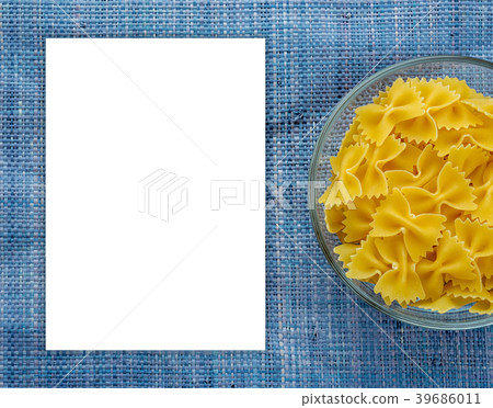 farfalle macaroni Pasta in glass cup on blue 39686011