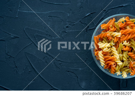 Multicolor spiral macaroni Pasta in a glass cup on 39686207