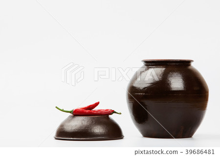 Chili peppers at Crock on white 39686481