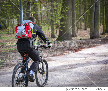 Young man riding on his bike In the park 39686567