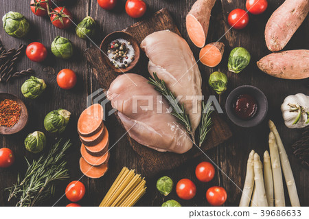 Raw chicken breasts and vegetables Raw chicken breasts and vegetables 39686633