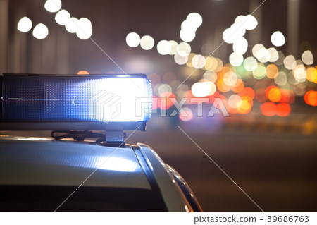 Police car at night, lights flashing in Seoul Police car at night, lights flashing in Seoul 39686763
