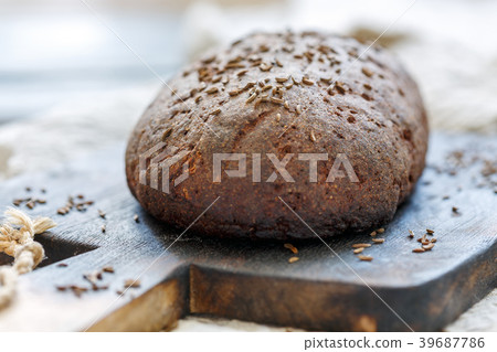 Loaf of artisan rye bread with cumin. 39687786