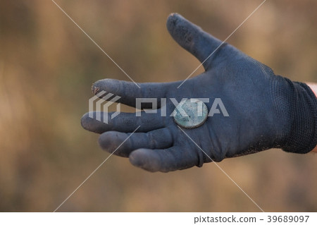 Closeup of antique dirty coin Closeup of antique dirty coin 39689097