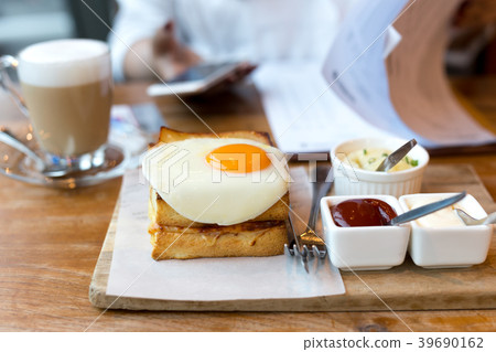 Toast cheese sandwiches with fried egg and coffee  39690162