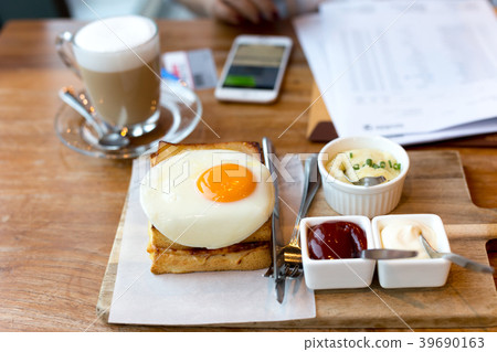 Toast cheese sandwiches with fried egg and coffee Toast cheese sandwiches with fried egg and coffee 39690163