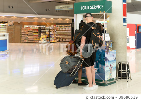 Tourist couple at tour service counter Tourist couple at tour service counter 39690519