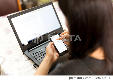 Business woman working with smart phone and laptop 39690524