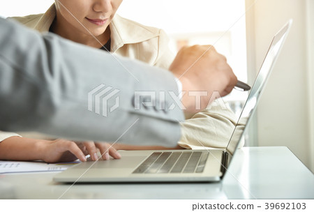 Asian Businesswoman is discussing with Businessman Asian Businesswoman is discussing with Businessman 39692103