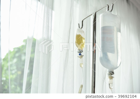 Close up saline IV drip. 39692104