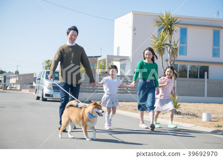Two elementary school children sister and family taking a dog walk 39692970