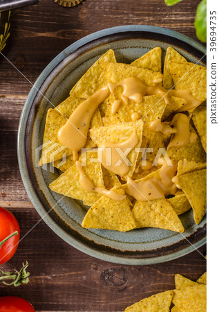 Nachos with homemade cheese dip 39694735