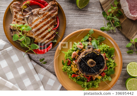 Grilled Pork Chops, risotto with portobello 39695442