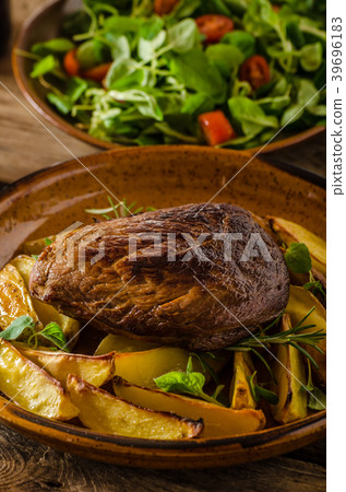 Beef steak with herbs and wine 39696183